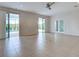 Expansive living area featuring tile floors, large windows, and seamless access to the outdoor pool area at 9157 Genesee St, Port Charlotte, FL 33981