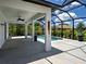 This spacious screened-in lanai area features a pool with lush landscaping and ample space for entertaining at 9157 Genesee St, Port Charlotte, FL 33981