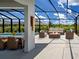 The pool patio has an outdoor dining area, seating and a fire pit at 9157 Genesee St, Port Charlotte, FL 33981