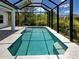 A gorgeous screened in pool area is perfect for year round swimming at 9157 Genesee St, Port Charlotte, FL 33981