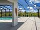 Spacious screened lanai with large column and view of swimming pool at 9157 Genesee St, Port Charlotte, FL 33981