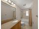 Well-maintained bathroom with shower/tub combo, tile floors and granite vanity top at 931 Inlet Cir, Venice, FL 34285