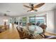 Dining area with water views, hardwood floors, and access to the outdoor deck at 931 Inlet Cir, Venice, FL 34285