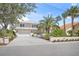 Charming two-story home with a well-manicured lawn, lush landscaping, and a convenient attached garage at 931 Inlet Cir, Venice, FL 34285