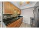 Kitchen featuring wood cabinets, mosaic backsplash, and stainless steel appliances at 931 Inlet Cir, Venice, FL 34285