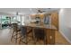 Modern kitchen with granite countertops, stainless steel appliances, and a breakfast bar at 931 Inlet Cir, Venice, FL 34285