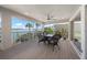 Waterfront lanai with plenty of seating to enjoy the view at 931 Inlet Cir, Venice, FL 34285