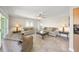 Bright living room features tile flooring, neutral paint, comfortable seating, and a ceiling fan at 931 Inlet Cir, Venice, FL 34285
