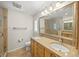 The main bathroom features a double sink vanity with granite counters and large walk-in shower at 931 Inlet Cir, Venice, FL 34285