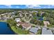 Scenic aerial view of a neighborhood with lush landscaping and lakeside views at 9528 Knightsbridge Cir, Sarasota, FL 34238