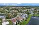 Scenic aerial view of a neighborhood with lush landscaping and waterfront homes at 9528 Knightsbridge Cir, Sarasota, FL 34238
