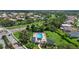 Aerial view of a community pool and lush green space at 9528 Knightsbridge Cir, Sarasota, FL 34238