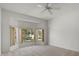 Carpeted bedroom with bay window letting in natural light at 9528 Knightsbridge Cir, Sarasota, FL 34238