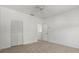 Bedroom features neutral carpet, a window and a closet with bifold doors at 9528 Knightsbridge Cir, Sarasota, FL 34238