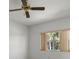 Bedroom featuring natural light, neutral color palette, and a ceiling fan at 9528 Knightsbridge Cir, Sarasota, FL 34238
