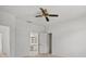 Bedroom featuring a ceiling fan and a view into the ensuite bathroom with vanity at 9528 Knightsbridge Cir, Sarasota, FL 34238