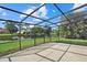View from inside a screened patio overlooking a serene pond and lush greenery, providing a peaceful outdoor space at 9528 Knightsbridge Cir, Sarasota, FL 34238