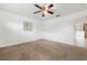 Bedroom with neutral walls, carpeted floor and ceiling fan at 2397 Morton Rd, North Port, FL 34291