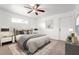 Cozy bedroom with neutral decor, ceiling fan, and natural light from window at 2397 Morton Rd, North Port, FL 34291