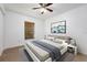 Bedroom with a ceiling fan and a window with blinds, and a bed with stylish decor at 2397 Morton Rd, North Port, FL 34291