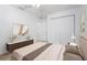 Staged bedroom with a ceiling fan, carpet flooring, and a modern-style entertainment center at 2397 Morton Rd, North Port, FL 34291