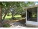 Exterior view highlighting the screened lanai and the home's connection to the serene backyard at 2397 Morton Rd, North Port, FL 34291