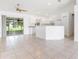 Eat-in kitchen with a center island, modern appliances, and sliding doors for seamless indoor-outdoor living at 2397 Morton Rd, North Port, FL 34291