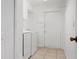 Laundry room with washer and dryer, tile floors, and white walls at 2397 Morton Rd, North Port, FL 34291