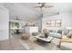 Bright, open-concept living room flows into the kitchen and dining area, perfect for modern living and entertaining at 2397 Morton Rd, North Port, FL 34291