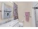 Bathroom features a marble countertop vanity, decorative towels, and shower at 102 Bayamo Dr, North Port, FL 34287