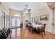Elegant dining room with tile floors, decorative columns, and ample seating at 102 Bayamo Dr, North Port, FL 34287