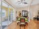 Open dining area with sliding glass doors for natural light and tile flooring throughout at 102 Bayamo Dr, North Port, FL 34287