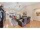 Comfortable living room featuring tile floors, vaulted ceilings, and a spacious layout at 102 Bayamo Dr, North Port, FL 34287