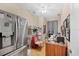 Functional home office with a refrigerator, a desk, and plenty of wall decor at 102 Bayamo Dr, North Port, FL 34287