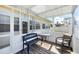 Relaxing screened-in patio with comfortable seating and a view of the outdoors at 102 Bayamo Dr, North Port, FL 34287