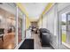 Bright sunroom with tile flooring, glass sliding doors, and space for dining and relaxation at 102 Bayamo Dr, North Port, FL 34287