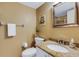 Bathroom with a granite countertop vanity, toilet, mirror, framed art and towel rack at 1100 Capri Isles Blvd # 215, Venice, FL 34292