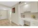 Welcoming entryway with tile flooring, a built-in bar area, and easy access to living spaces at 1100 Capri Isles Blvd # 215, Venice, FL 34292