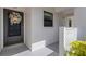 Charming front entrance featuring unit 215 and a welcoming decorative wreath on the door at 1100 Capri Isles Blvd # 215, Venice, FL 34292