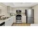 Well-equipped kitchen with stainless steel appliances and ample counter space for meal preparation at 1100 Capri Isles Blvd # 215, Venice, FL 34292
