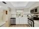 Spacious kitchen with stainless steel appliances, ample counter space and convenient dishwasher at 1100 Capri Isles Blvd # 215, Venice, FL 34292