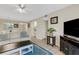 Spacious living room featuring comfortable seating and an open layout leading to the dining area at 1100 Capri Isles Blvd # 215, Venice, FL 34292