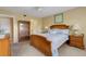 Inviting main bedroom with ceiling fan and window at 1100 Capri Isles Blvd # 215, Venice, FL 34292