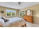 Comfortable main bedroom with large window at 1100 Capri Isles Blvd # 215, Venice, FL 34292