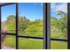 Stunning waterfront view through screened lanai at 1100 Capri Isles Blvd # 215, Venice, FL 34292