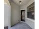 Covered front entry with decorative glass door, brick pavers, and sidelight window at 11192 Campazzo Dr, Venice, FL 34292