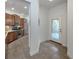 Bright kitchen area showing stainless steel appliances, granite countertops, and tile flooring at 11192 Campazzo Dr, Venice, FL 34292