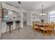 Bright, open living area with seamless flow into the dining and kitchen spaces at 11192 Campazzo Dr, Venice, FL 34292