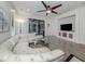 Bright living room features a large sectional sofa, glass table, and access to a patio at 11192 Campazzo Dr, Venice, FL 34292