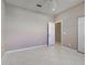 This bedroom includes tile flooring, a ceiling fan, light colored walls, and interior doorway at 1136 Deardon Dr, Venice, FL 34292
